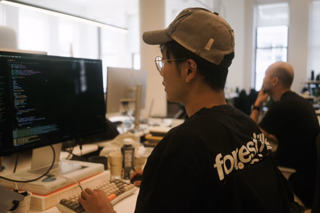 Chang and Xiulung cooking at the office